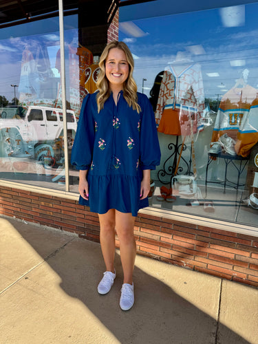 Blue long puff sleeves lovely dress with floral embroidery, tie neck detail, side pockets.