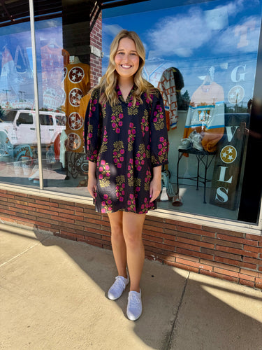Floral pattern V-neck band collar mini dress featuring ¾ band puff sleeves. Side pockets