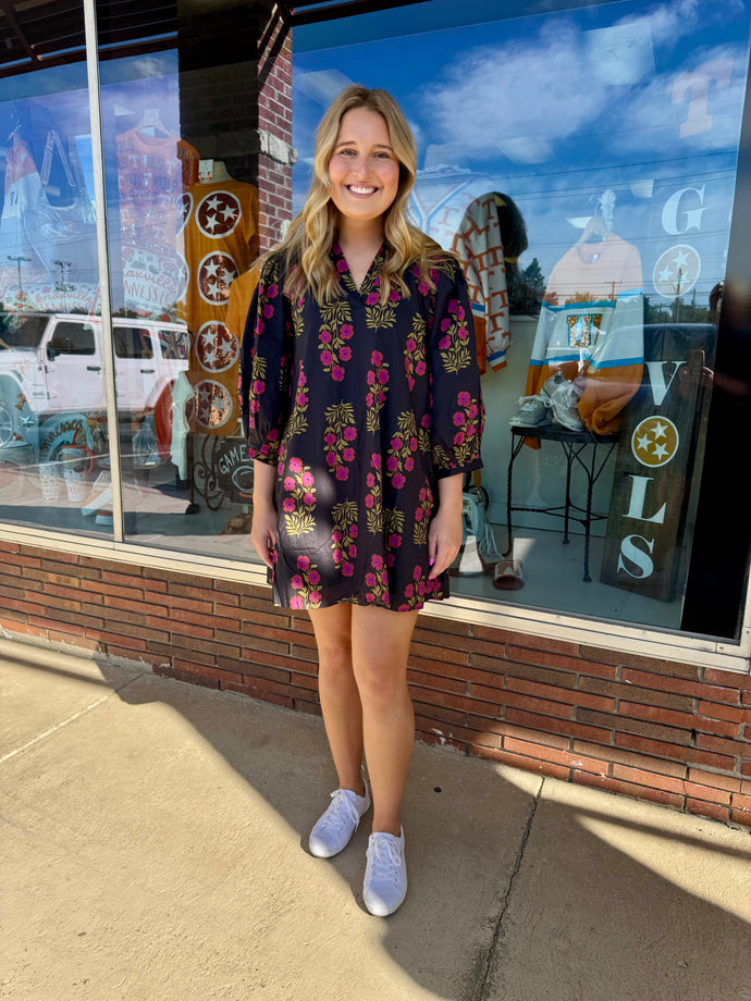 Floral pattern V-neck band collar mini dress featuring ¾ band puff sleeves. Side pockets